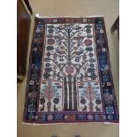 A hand knotted Shiraz rug with a cream field - 1.54 m x 1.11 m