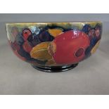 A Moorcroft fruit and pomegranate bowl, signature to base 
Condition report: Some interior