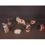 Seven Crown Derby gold stopper paperweights - to include Seal, Rabbit, Pig, Chipmonk, Robin, Cat &