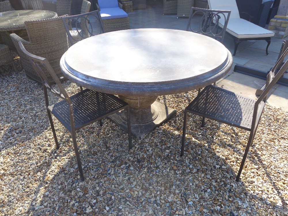 A Bramblecrest Venetian 120cm round table with pedestal base and four metal armchairs