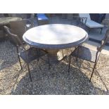 A Bramblecrest Venetian 120cm round table with pedestal base and four metal armchairs