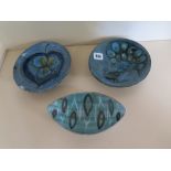 A Studio pottery dish by Janice Tchalenko decorated with a peacock design, a Chelsea pottery dish