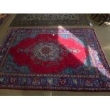 A red ground handmade Persian Tabriz carpet - 3.00 m x 2.10 m