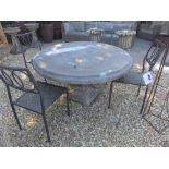 A Bramblecrest Venetian round table 120cm diameter with pedestal base and four metal side chairs