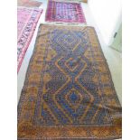 A Belouch Afghan carpet with geometric patterns and borders on brown ground - 200 cm x 107 cm and a