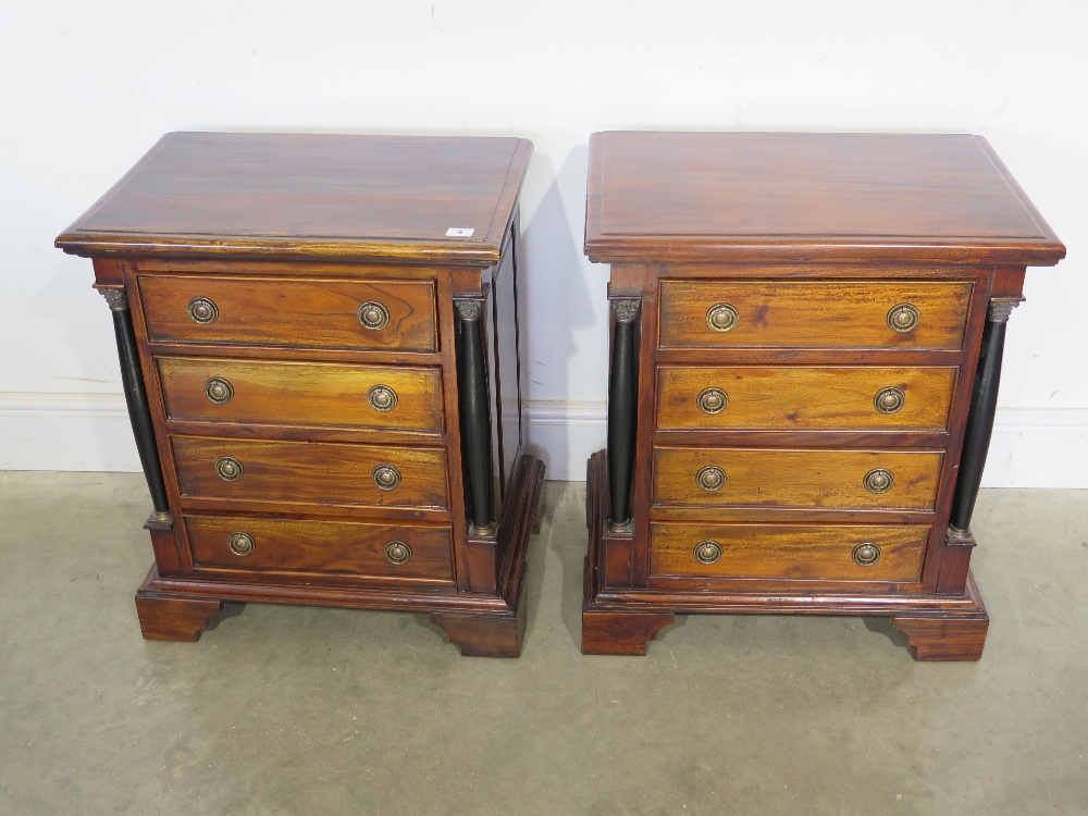 A pair of reproduction mahogany four drawer chests or bedside chests with Corinthian capitals