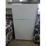 A white melamine three tilt drawer shoe cabinet