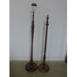 Two mahogany standard lamps