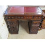 A modern mahogany effect eight drawer twin pedestal desk - 93 cm x 53 cm