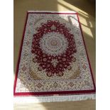 A red ground very fine silk rug - 1.74 cm x 1.20 cm