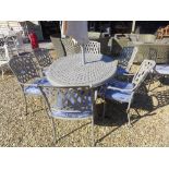 A Bramblecrest Rome elliptical table 167cm x 112cm with six stacking armchairs, blue seat pads,