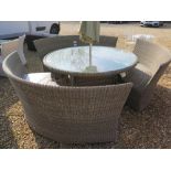 A Bramblecrest Sahara round table 165 cm and three Sahara bench 150 cm, a 3m  Alu parasol and