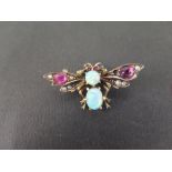 A silver gilt multi-gem bee brooch - Set with opal, garnet, seed pearl and ruby - Stamped 800 -