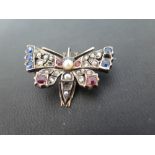 A late Victorian silver and gold rose-cut diamond, sapphire, ruby and seed pearl moth brooch -