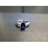 An 18ct gold sapphire and diamond ring - Hallmarked Birmingham - Ring size L 1/2 - Weight approx