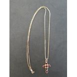 A 9 ct gold garnet crucifix and a 9 c t gold chain - Total weight approx. 4 grms
