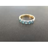 An 18ct gold topaz five-stone ring - Hallmarked Birmingham - Ring size P - Weight approx