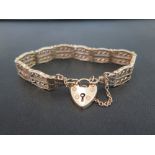 A 9ct gold fancy-link articulated panel bracelet - With partial hallmark - Length 18.5cms - Weight