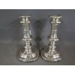 A pair of heavy silver plate or Sheffield plate silver candlesticks in the George III style -