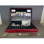 A Fifty eight piece canteen of cutlery by Viners, a silver hallmarked handle cake knife, a ladle, a