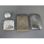 A good silver vesta and a silver sovereign case and two silver cigarette cases - the vesta with