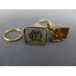 Two fobs - one with monogram one with stags head and a 22 ct gold wedding band