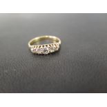 An diamond five-stone ring - The old-cut diamonds in a raised claw setting - Stamped 18ct - Ring