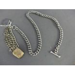 A silver watch chain converted to a double row bracelet with a rectangular locket attached - wear
