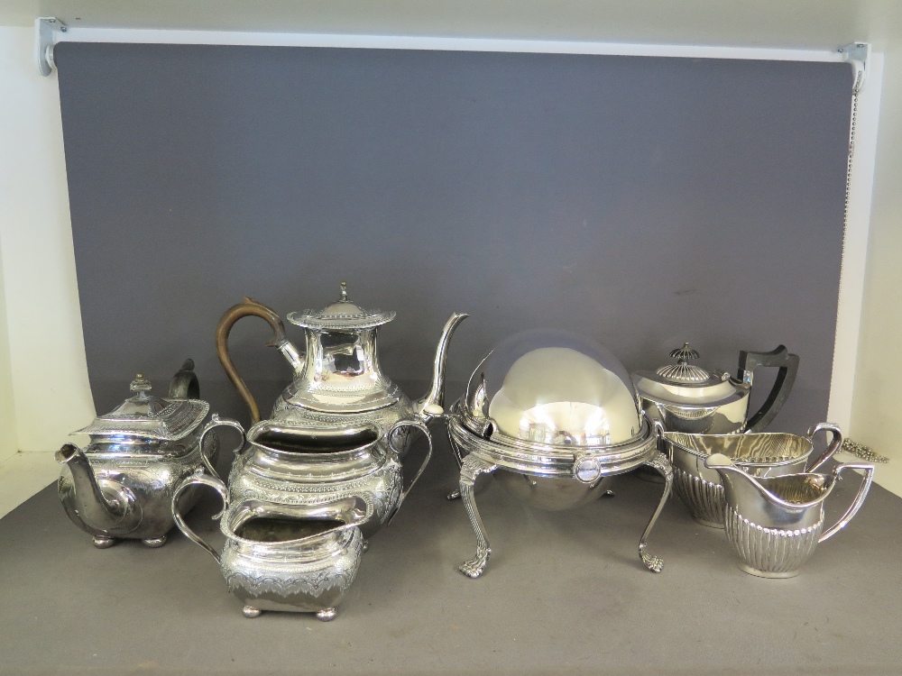 A large quantity of silver plated wear - two tea services and server including tea, coffee, milk