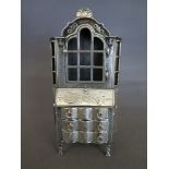 An 1860 silver  miniature bookcase/bureau - Dutch hallmark - with three small internal drawers -