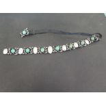 A late 19th/early 20th century silver and gold diamond, emerald and mother of pearl choker - The