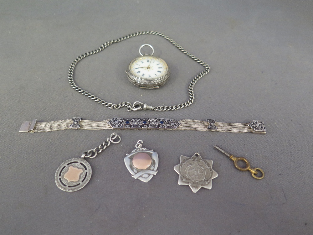 A German silver pocket watch marked .935 for Berlin, three pendants, a silver chain and a bracelet