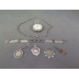 A German silver pocket watch marked .935 for Berlin, three pendants, a silver chain and a bracelet