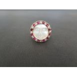 A diamond ruby and rock crystal ring - The circular rock crystal, carved to depict a face within a