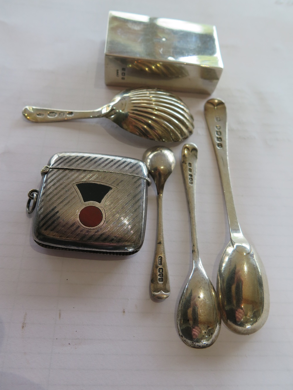 Various assorted hallmarked silver items including matchbox cover, four spoons and a white metal