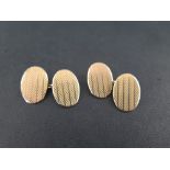 A pair of 9ct gold cufflinks - With textured detail - Weight approx 8.7gms
Condition Report: Good -