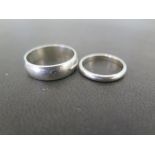 A platinum band ring - Approx 2.5mm - Hallmarked Birmingham - Ring size K - Together with a further