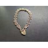 A 9ct gold bracelet - With padlock clasp - Hallmarked Birmingham - Length 18cms - Weight approx