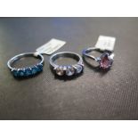 Three gem-set rings - To include apatite, zircon and tourmaline - Two stamped 925 - Ring sizes N, N