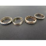 Three marcasite and gem-set full-circle rings - Together with a bi-colour band ring - Test silver