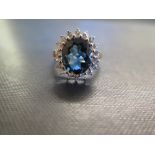 A 9ct gold topaz and white-gem cluster ring - Hallmarked Birmingham - Ring size O 1/2 - Weight