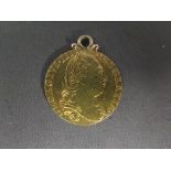 A George III Guinea pendant - Total weight approx. 8.7 grms