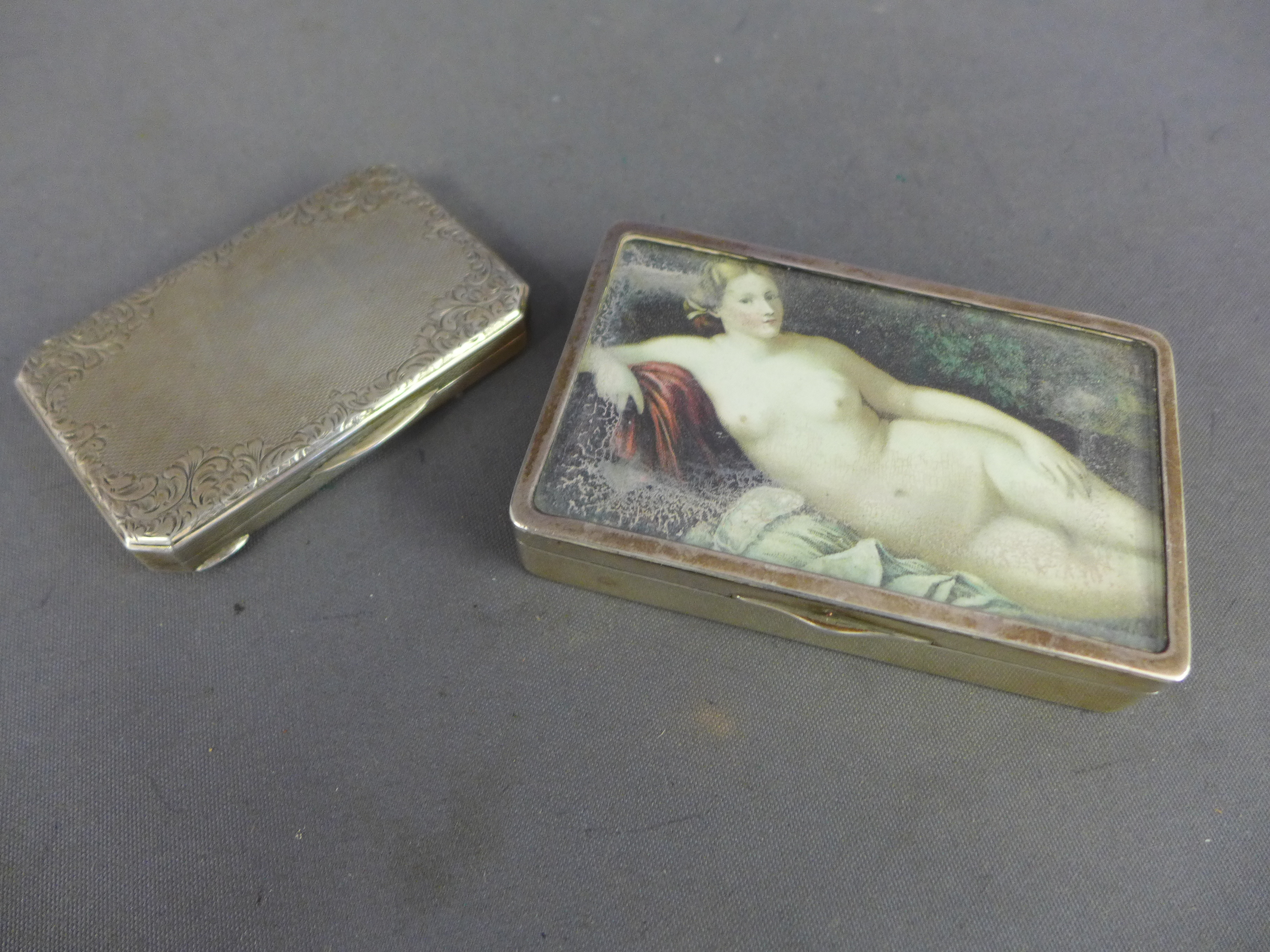 A good Continental silver gilt lined snuff box, the top with a print of a naked reclining female