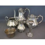 A four piece plated teaset, a vase and a basket