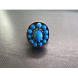 A turquoise cabochon cluster ring - Tests as 18ct gold - Ring size P 1/2 - Weight approx