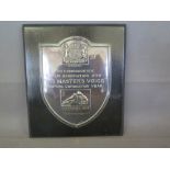 A hallmarked silver plaque given to Turner and Sons Cambridge Ltd to Commemorate your association