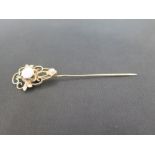 An opal and seed pearl stick pin - Stamped 14K - Length 7.5cms - Weight approx 3.9gms
Condition