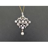 A late 19th/ early 20th century gold diamond and pearl pendant - The old-cut diamonds to the