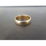 A 9ct gold band ring - Hallmarked London - Width approx 6mm - Weight approx 4.9gms
Condition