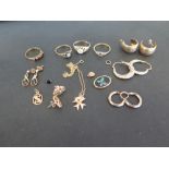 A mixed lot of 9 ct jewellery including a CZ Gypsy style ring, garnet four stone ring, sapphire and